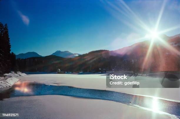A Sunny Day On A Frozen Lake On The Swiss Alps Shot With Analogue Film Photography Stock Photo - Download Image Now