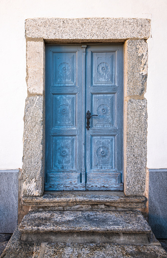 Old church door at the church San Martino in the village Ronco sopra Ascona at the Swiss part of the beautiful lake Lago Maggiore.