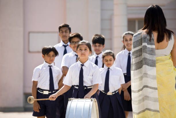 istock Teacher with marching band in school assembly 1146921745
