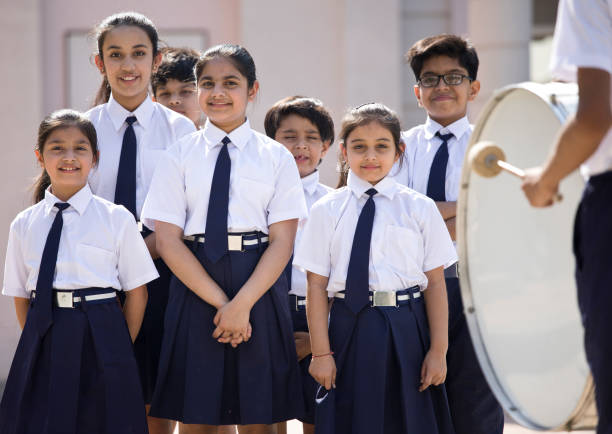 istock Group of students drumming in school assembly 1146922320
