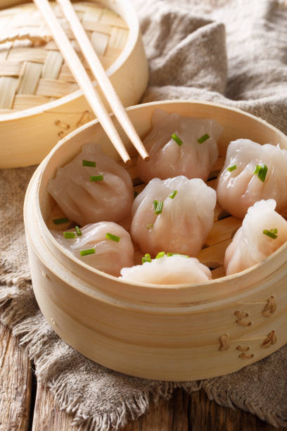 istock cooked dumplings inside of bamboo steamer. vertical 1146922768