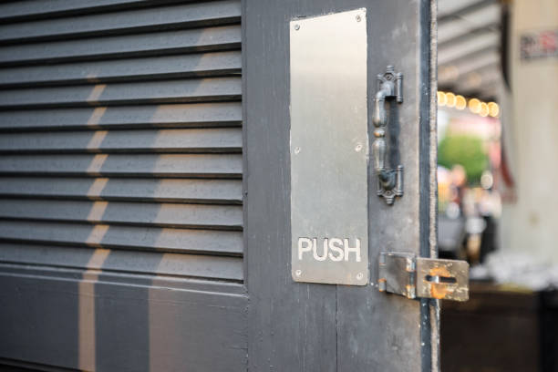 istock Restaurant door handle with push sign on doors 1146925254