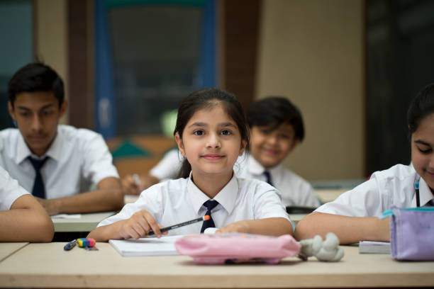 istock Group of students studying book at classroom 1146925297