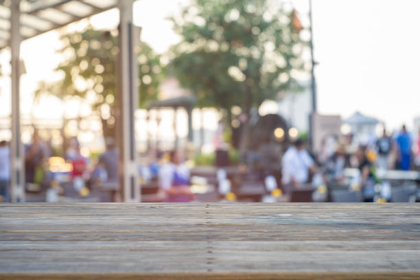 istock image of wooden table in front of abstract blurred background 1146925336