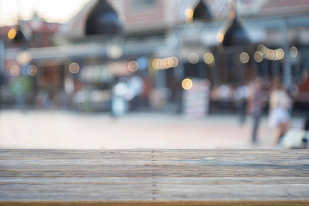 istock image of wooden table in front of abstract blurred background 1146925340