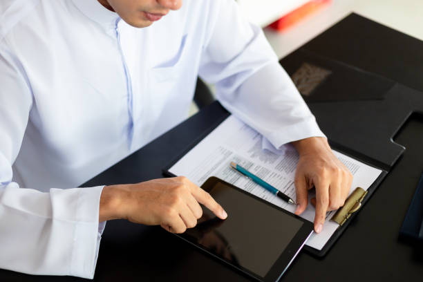 istock Young muslim man used tablet in office 1146925791