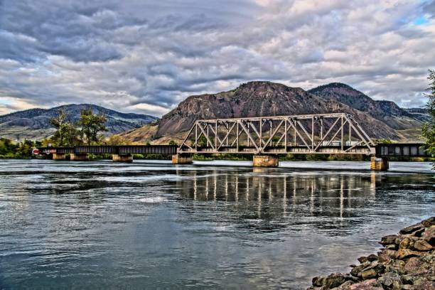 Railway bridge over Thompson river at Kamloops You can enjoy the view from Riverside park kamloops stock pictures, royalty-free photos & images