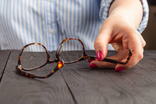istock Glasses frame in wonam hand on wooden table 1146926007