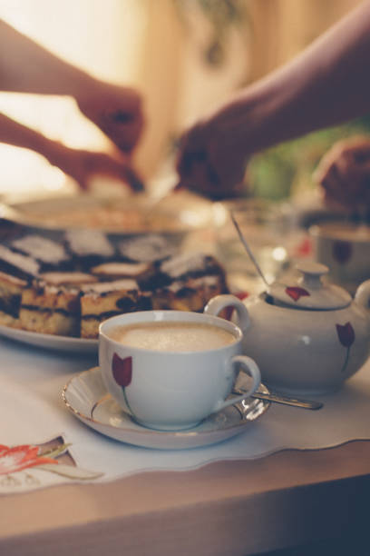 istock Warm coffee in a cup and cake on the table. Retro stylized photo. 1146929652