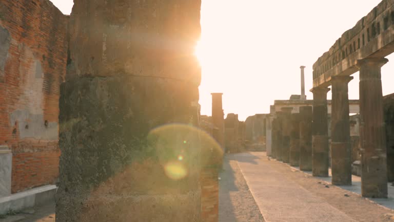 Pompeii, Italy. Beautiful Sun Sunshine Through Throuh Remains Of Ancient Building On Territory Of Pompeii Forum. Sunlight During Sunset