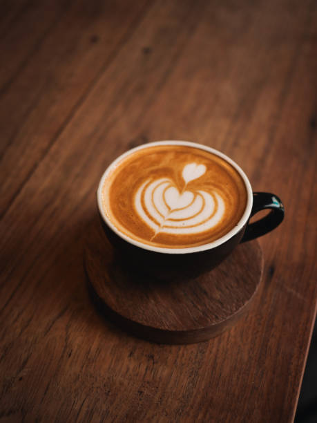 istock coffee latte on the wood desk in cafe 1146930799