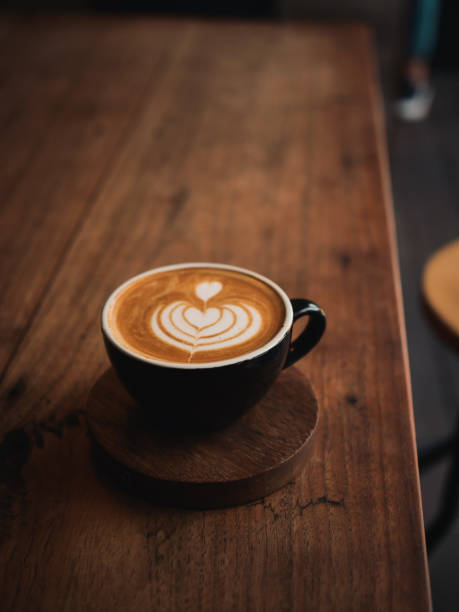 istock coffee latte on the wood desk in cafe 1146931306