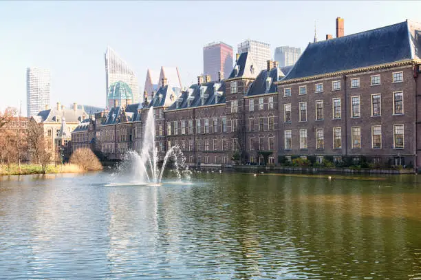 View of the Hofvijver / Court Pond adjoined by the Binnenhof (Inner court) housing the States General and the Prime Minister of The Netherlands in The Hague, The Netherlands.
