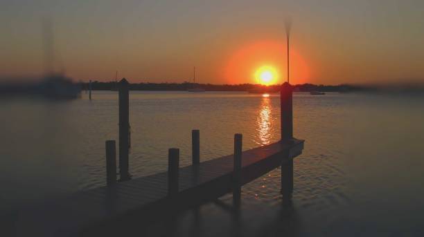 istock Fire sunset on water's horzon 1146931535