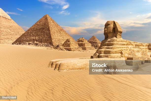 The Sphinx Of Giza Next To The Pyramids In The Desert Egypt Stock Photo - Download Image Now