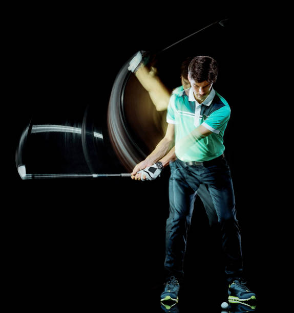Golfer man golfing golf swing isolated black background multiple exposure