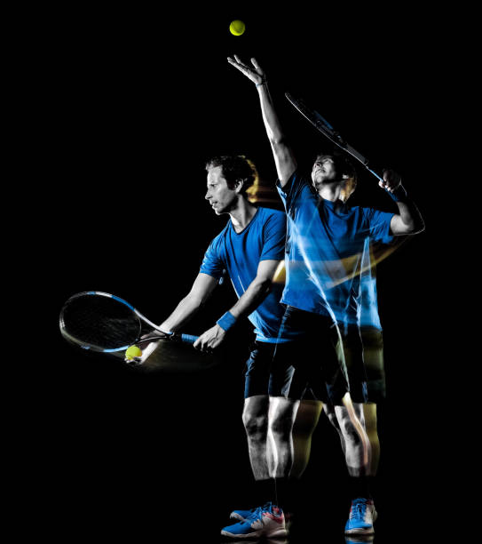 istock tennis player man isolated black background light painting speed motion 1146933009