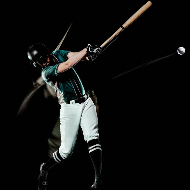 istock baseball player man isolated black background light painting 1146933050