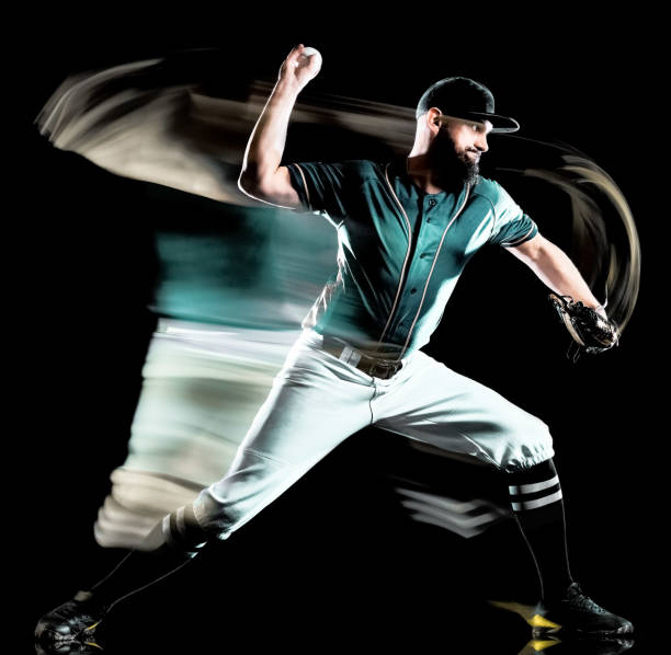 istock baseball player man isolated black background light painting 1146933068