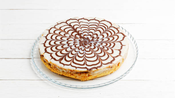 istock Homemade pie with cottage cheese and prunes poured with white icing 1146935062