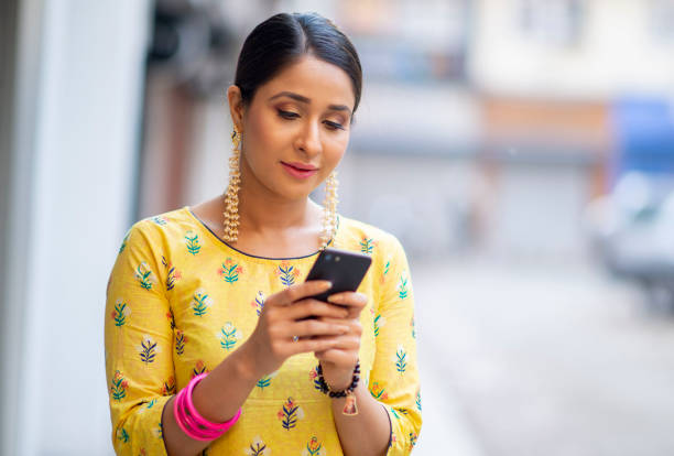 istock Beautiful Indian woman texting 1146935838