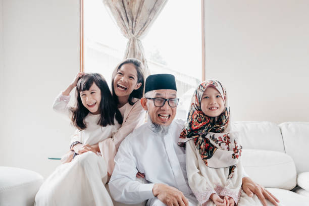 Grandfather with Grandchild during Eid Mubarak Hari Raya Aidilfitri Celebration in Malaysia eid ul fitr photos stock pictures, royalty-free photos & images