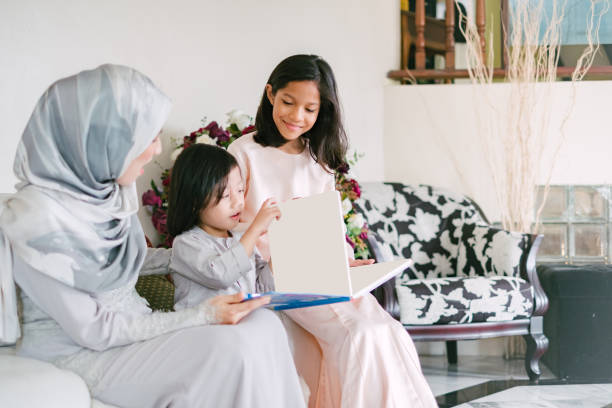 istock Young Women Teaching Her Daughter with Book 1146944979