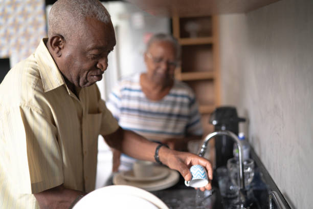 istock Senior couple doing the dishes 1146945413