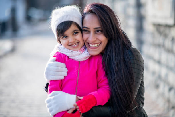 istock Muslim mother hugging daughter 1146951426