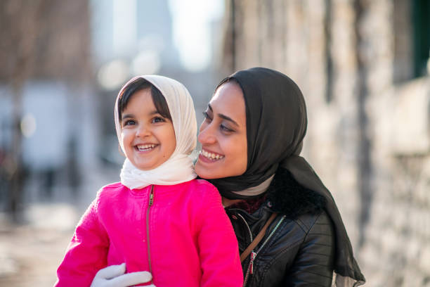 istock Muslim mother hugging daughter 1146951456