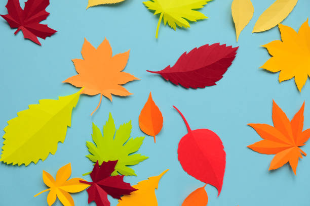 istock Leaves of paper fall red, orange, yellow leaf fall. 1146952091