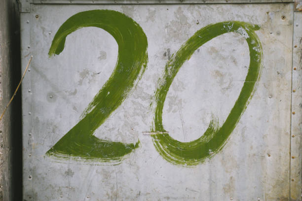Green number twenty (20) painted on a rusty plate