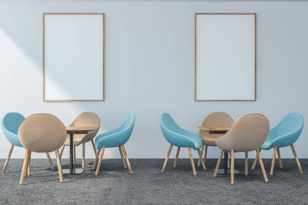 istock White restaurant interior with wooden tables, chairs. 3d render. Mock up. Posters on wall. 1146952498