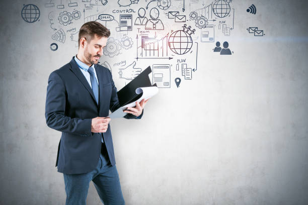 istock Businessman with clipboard, business plan 1146952858