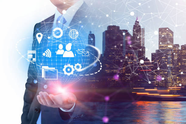 istock Man holding virtual internet icons in city 1146952950