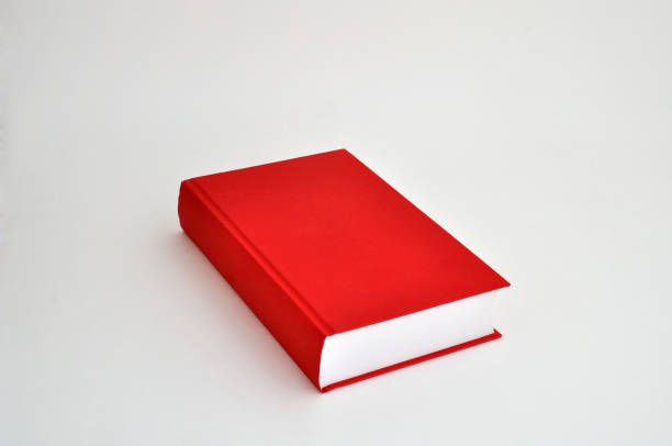 istock Red book on a light background with an area for an inscription or text 1146953800