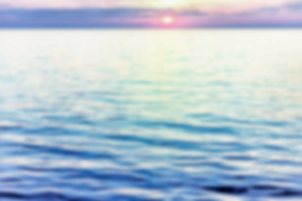 istock Pastel blurred setting sun near the horizon at sea 1146953925