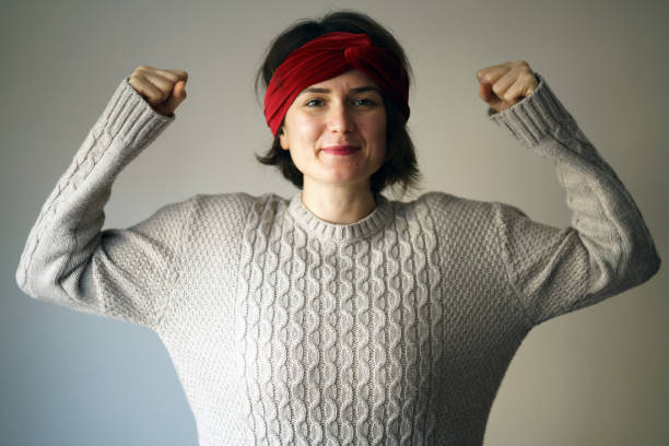 istock Young woman shows her strong arm 1146954170