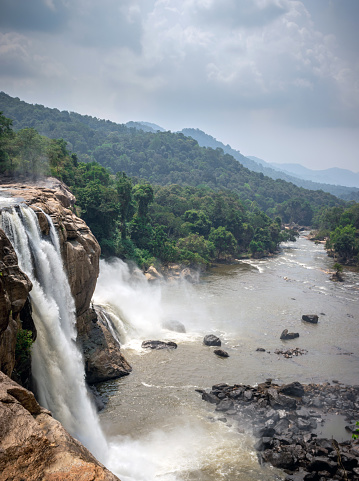 This is the athirapally waterfall kerala india in the middle of the western ghat range. It is falling from 80 mtrs high hill and it is the second largest waterfall in india.