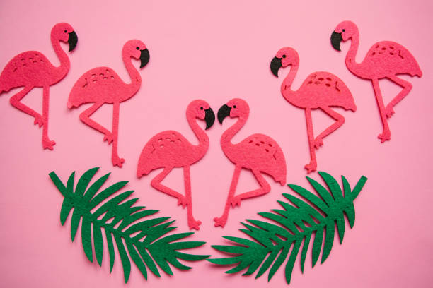 istock Flamingo and leaves on a pink background. Summer design 1146957396