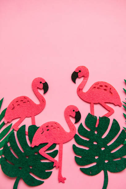 istock Flamingos and leaves on a pink background. Summer design. 1146958909