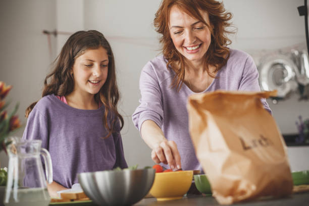 istock Mother preparing healthy lunch for her daughter 1146959066
