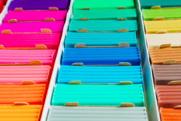 istock Rainbow colors of modeling clay. Multicolored plasticine bars in a box, background texture 1146960262