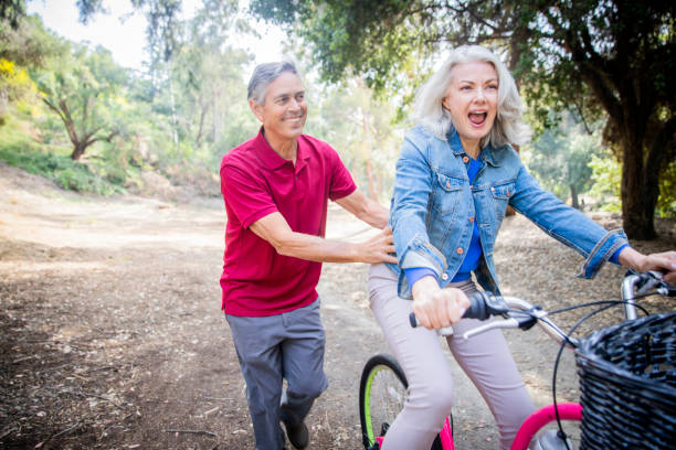 istock Husband Pushing Wife on Bicycle 1146961108