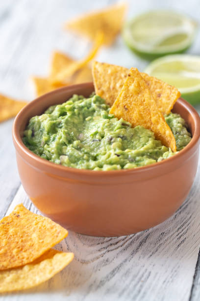 istock Bowl of guacamole with tortilla chips 1146961604