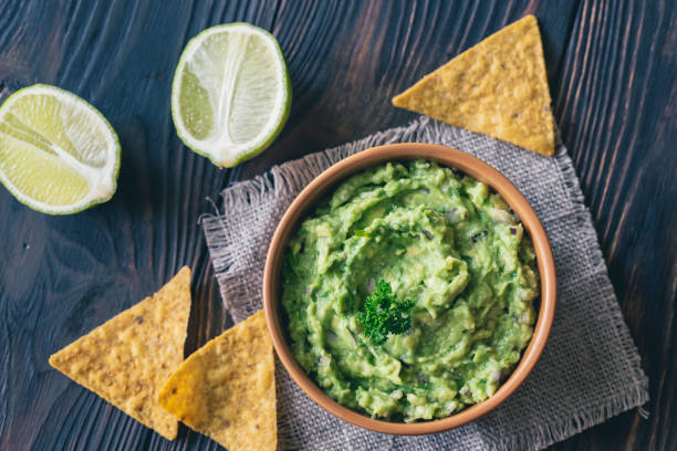 istock Bowl of guacamole with tortilla chips 1146961632