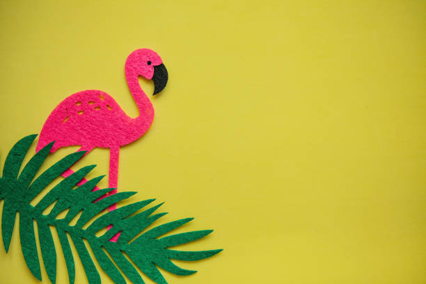 istock Flamingo and leaves on a yellow background. Summer design. 1146961693