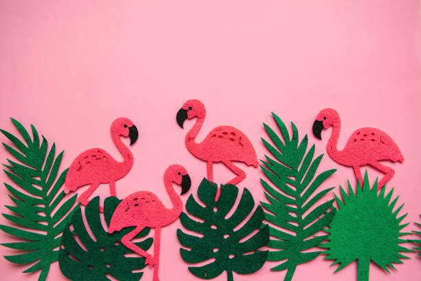 istock Flamingos and leaves on a pink background. Summer design. 1146963819