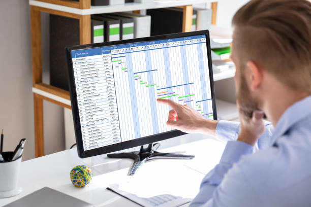 istock Businessman Working On Gantt Chart On Office Desk 1146964017