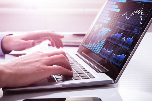 istock Stock Market Broker Analyzing Graph On Laptop 1146965361